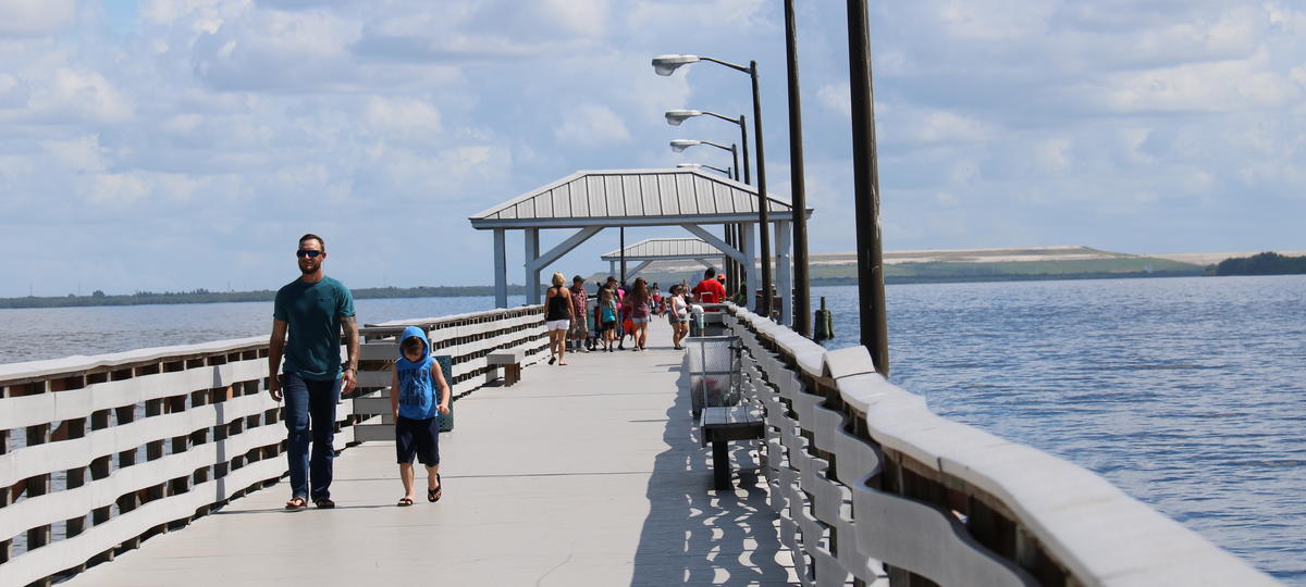 People walking on pier